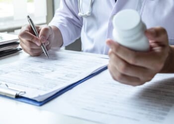 doctor holding pills