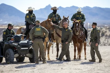 Border Patrol agents wait for the arrival of Defense Secretary Pete Hegseth for a visit to the US-Mexico border in Sunland Park, N.M., Monday, Feb. 3, 2025. (AP Photo/Andres Leighton)