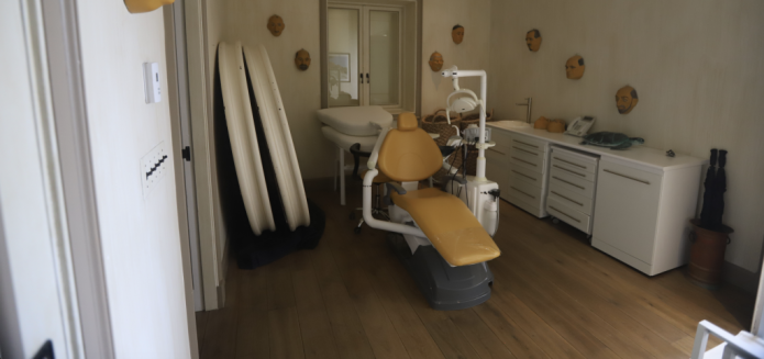 A room featuring a dentist chair and masks on the wall in the late convicted sex offender Jeffrey Epstein's house on his private island.
