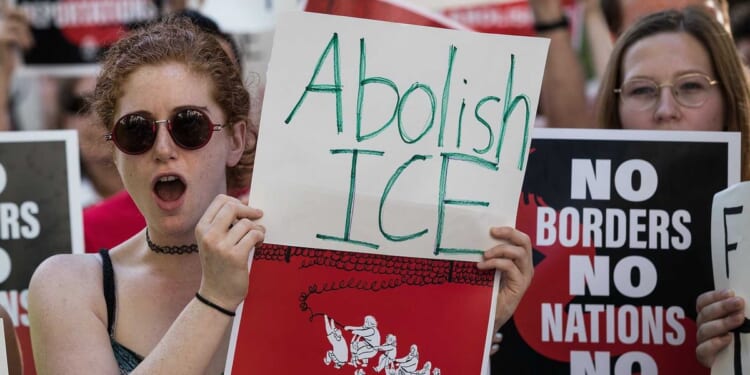 Liberal protesters dump ice into harbor on anniversary of Boston Tea Party to protest deportations