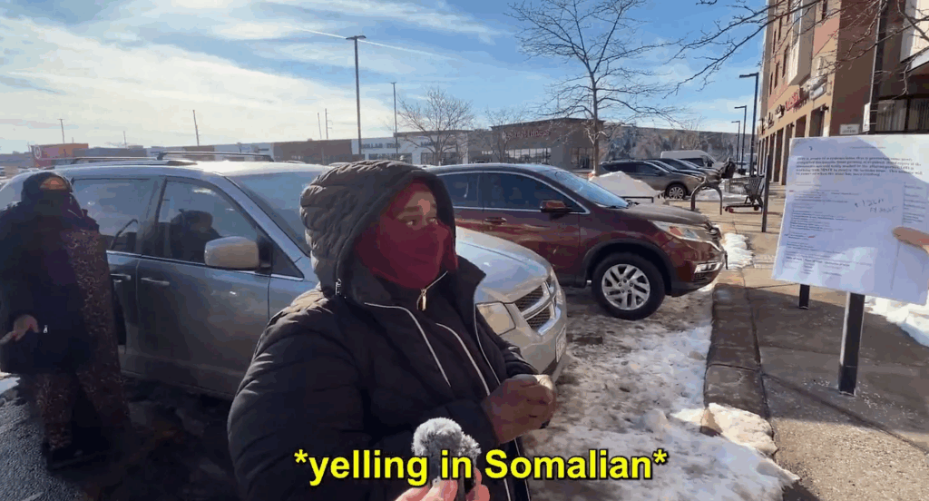 woman in head covering above caption reading 'yelling in Somalian"