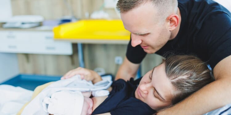 Mom, Dad, and baby after mom gave birth