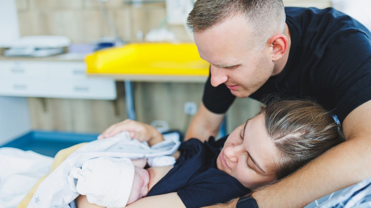 Mom, Dad, and baby after mom gave birth