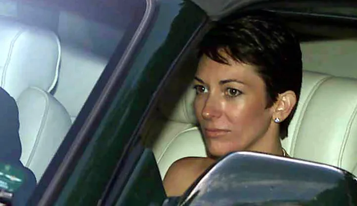 In this Sept. 2, 2000, file photo, British socialite Ghislaine Maxwell, driven by Britain's Prince Andrew, leaves a wedding.