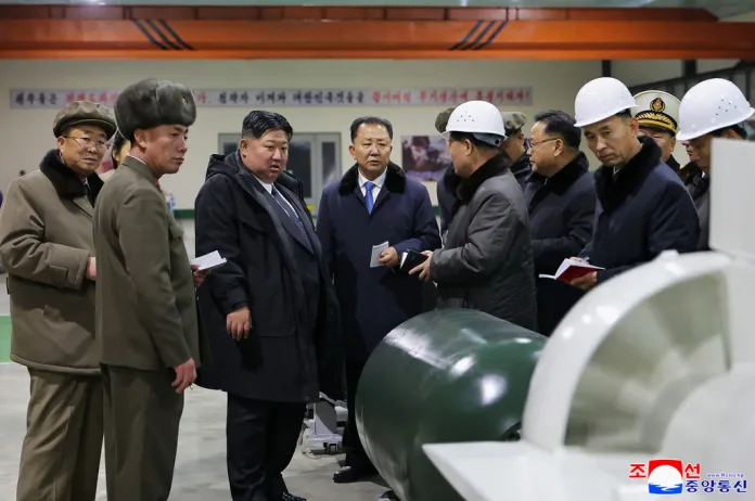 North Korean leader Kim Jong Un visits a shipyard as he inspects a nuclear-powered submarine under construction.