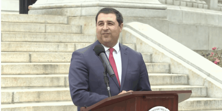 Wisconsin Attorney General Josh Kaul holds a press conference on the state capitol steps.