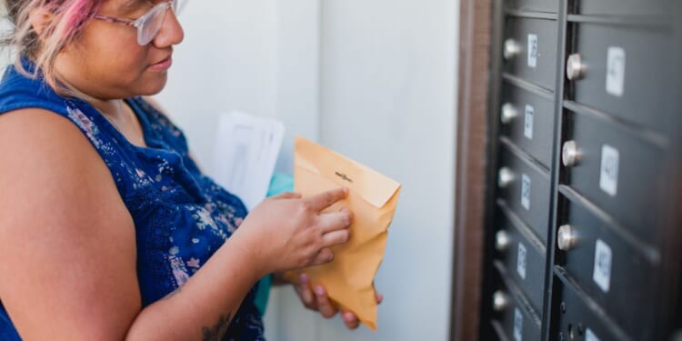 woman opens package