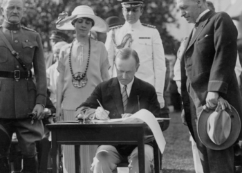 Calvin Coolidge signing legislation