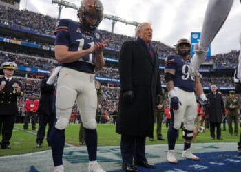 Trump takes the field at Army-Navy game for coin toss, military flyover