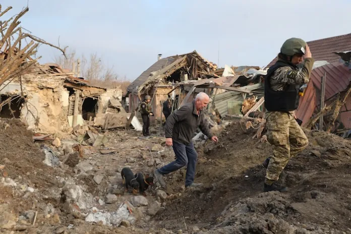 A man walks in front of his house that was destroyed after a Russian attack on Zaporizhzhia, Ukraine.