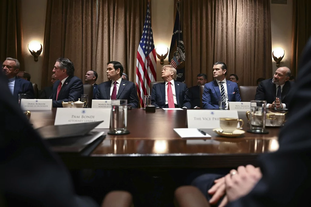 President Donald Trump holds his first Cabinet meeting at the White House in Washington, Wednesday, Feb. 26, 2025. (Pool via AP)