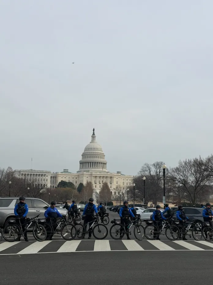 Capitol police line up outside of the U.S Capitol building as January 6 defendants and families peacefully approach. (Sydney Topf/Washington Examiner)