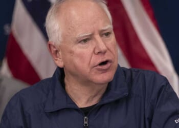 Tim Walz says Minnesota is 'at war' with the federal government after fatal ICE shooting