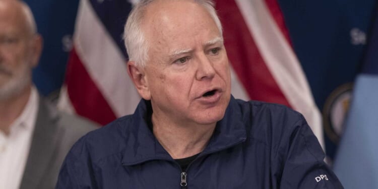 Tim Walz says Minnesota is 'at war' with the federal government after fatal ICE shooting
