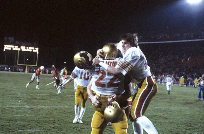 Boston College quarterback Doug Flutie (22) celebrates with his brother, Darren, after throwing a game-winning Hail Mary touchdown vs Miami on Nov. 23, 1984. (Heinz Kluetmeier /Sports Illustrated via Getty Images)