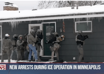 Department of Homeland Security officers surround the home of a suspected criminal illegal alien in Minneapolis.