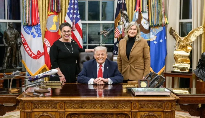 Rep. Harriet Hageman (R-WY) stands beside President Donald Trump and Sen. Cynthia Lummis (R-WY) in the Oval Office.