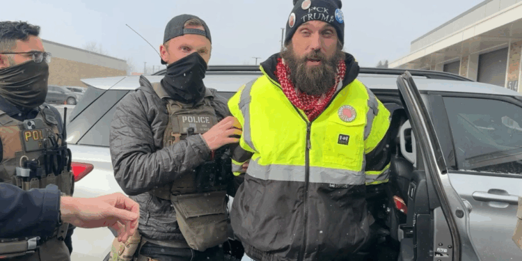 William Kelly being arrested