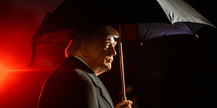 Donald Trump under an umbrella