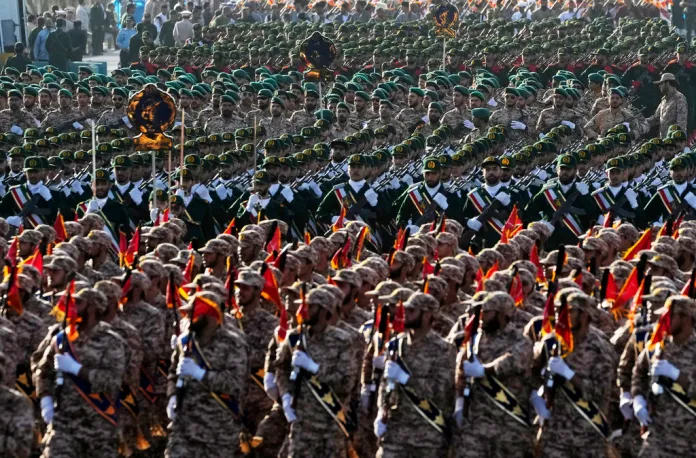 Islamic Revolutionary Guard Corps members march in Tehran