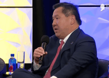 James Ho speaking at a lecture.