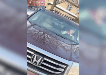 still of Renee Good driving her car from ICE agent's perspective