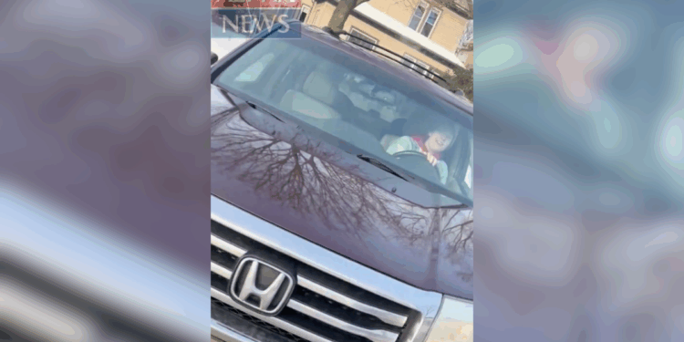 still of Renee Good driving her car from ICE agent's perspective