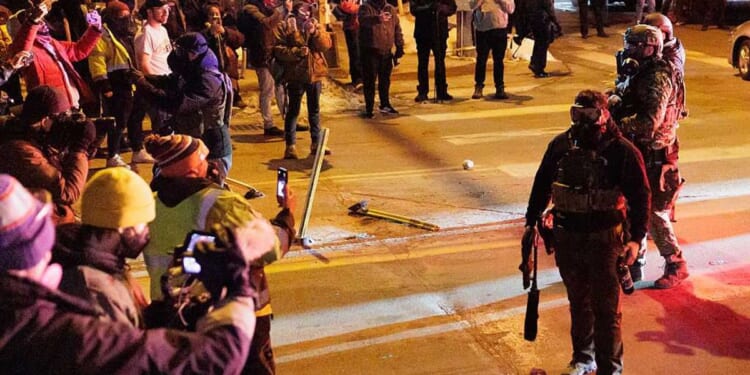 Minneapolis chaos escalates: Federal prison guards in riot gear block hateful mob after another ICE shooting