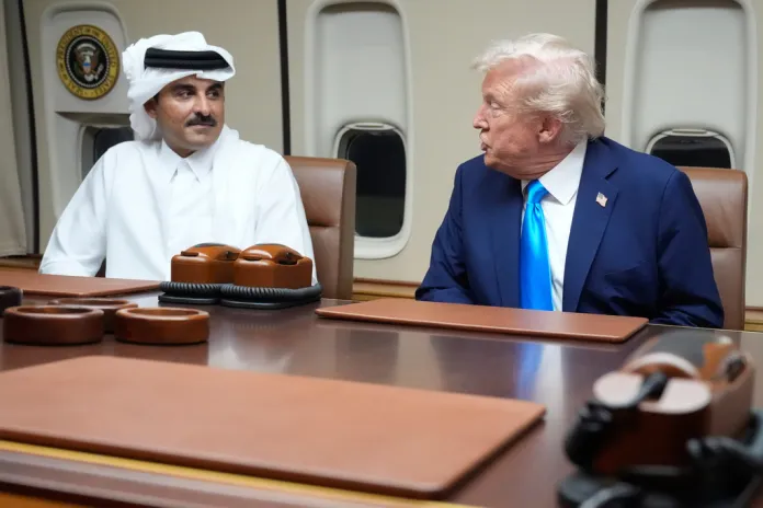 Trump sits with the Emir of Qatar aboard Air Force One