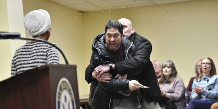 Questions linger after man sprays liquid onto Rep. Ilhan Omar during speech on impeachment — hazmat identifies liquid