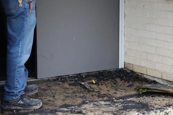 Zach Shemper, president of Beth Israel Congregation, stands in ashes outside the congregation’s temple hours after the building was damaged by fire Saturday, Jan. 10, 2026 in Jackson, Miss. (Allen Siegler/Mississippi Today via AP)