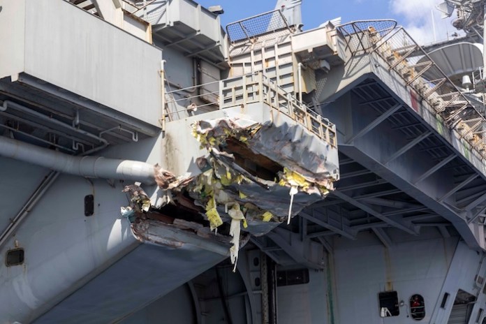 This image provided by the U.S. Navy shows exterior damage of the USS Harry S. Truman, viewed from a ship's rigid-hull inflatable boat following a collision with merchant vessel Besiktas-M, Feb. 12, 2025, while operating in the vicinity of Port Said, Egypt. (Cody Beam/U.S. Navy via AP)