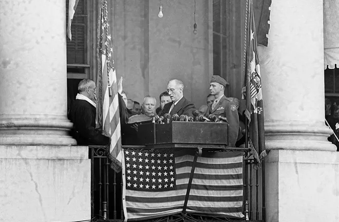 President Franklin D. Roosevelt (second from right) repeats the oath of office at his fourth inauguration on the rear porch of the White House on Jan. 20, 1945. (AP Photo)