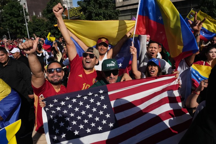 Venezuelans celebrate after U.S. President Donald Trump announced that Venezuelan President Nicolas Maduro had been captured and flown out of the country in Santiago, Chile, Saturday, Jan. 3, 2026.