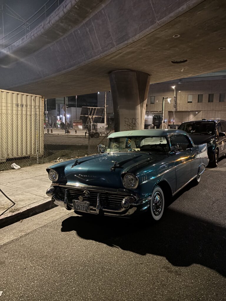 A beautiful vintage Chevrolet sits under a concrete overpass near the Metropolitan Detention Center in Downtown Los Angeles.