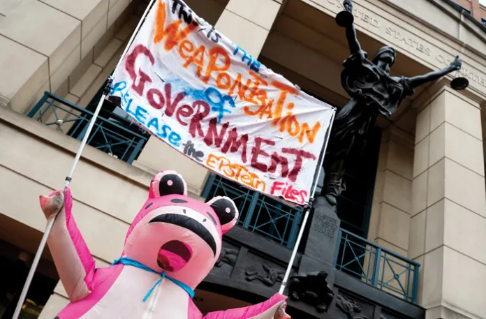 But I’m all for it when my side does the weaponizing: A person in a frog costume protests the prosecution of James Comey in Alexandria, Virginia, Nov. 19, 2025. (Nathan Howard/Getty)
