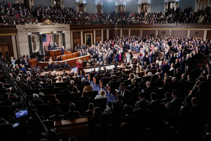 Republican members of Congress stand while Democrats keep their seats during President Donald Trump¥s State of the Union address to a joint session of Congress in the House chamber at the U.S. Capitol in Washington, Tuesday, Feb. 24, 2026. (AP Photo/Alex Brandon)
