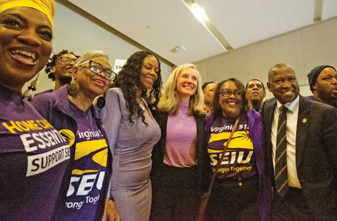 Gov. Abigail Spanberger (D-VA), center, poses while campaigning with members of the public-sector Service Employees International Union (SEIU) in Richmond, Virginia, April 8, 2025. (Max Posner/Washington Post/Getty)