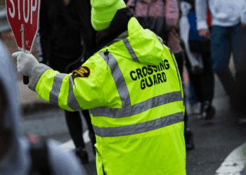 'Disgusting': Thug caught on video punching female crossing guard in face, knocking her out as elementary schoolers watch