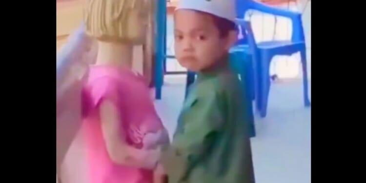 Someone Please Save the Mannequin From this Little Muslim Boy!