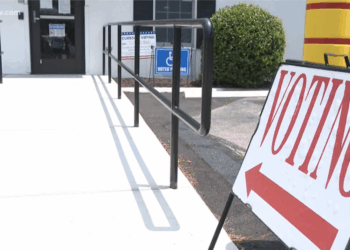 A voting sign in front of a polling station as early voting continues in Virginia's April referendum.
