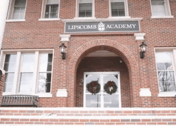 A brick building with a "Lipscomb Academy" sign on it