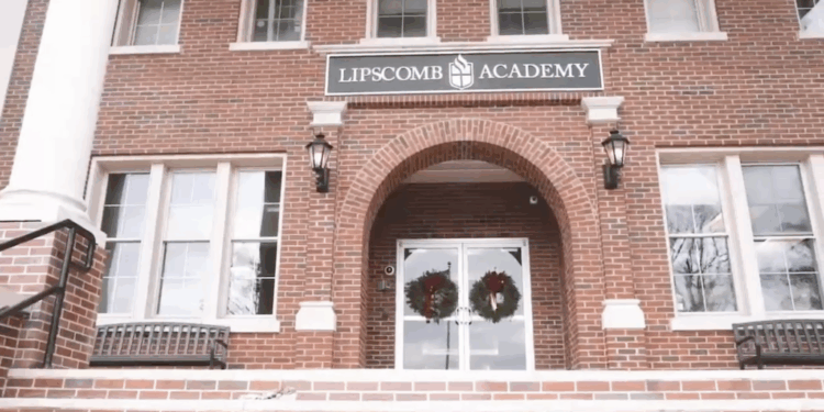 A brick building with a "Lipscomb Academy" sign on it