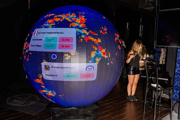 Polymarket takes over a local bar for a pop-up experience with the goal of functioning like a data hub featuring real-time feeds, market odds, and numerous screens providing live updates on major events on March 20, 2026 in Washington, D.C.
