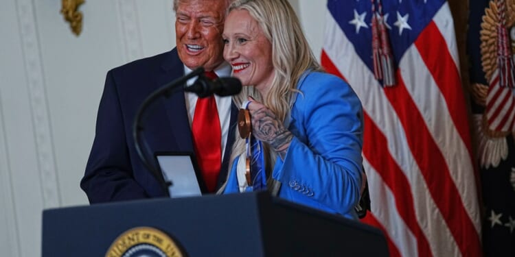 Olympic bobsledder awards Trump her 'Order of Ikkos' medal