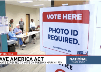 A sign at an election polling station to voters will need ID to vote.
