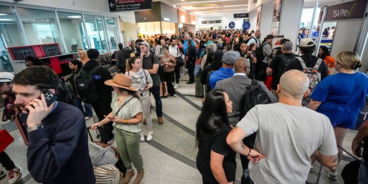 Storms and DHS shutdown snarl flights as airports see delays