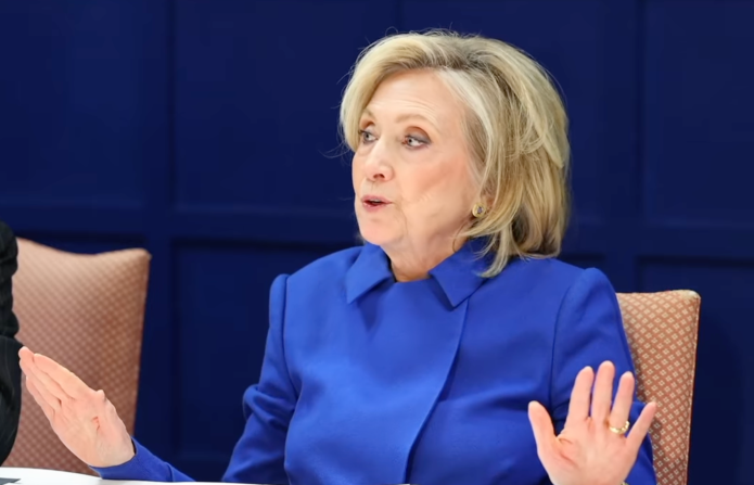 Hillary Clinton reacts after learning that photos of her deposition were leaked online