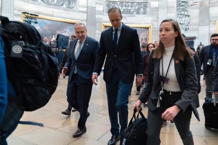 Senate Minority Leader Chuck Schumer (D-NY) and Senate Majority Leader John Thune (R-SD) lead a Senate procession through the Rotunda.