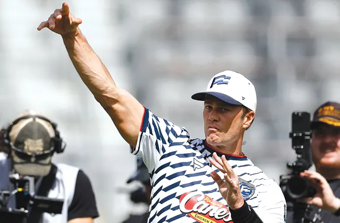 Tom Brady warms up at the Fanatics Flag Football Classic March 21 in Los Angeles. (Caroline Brehman/AP)
